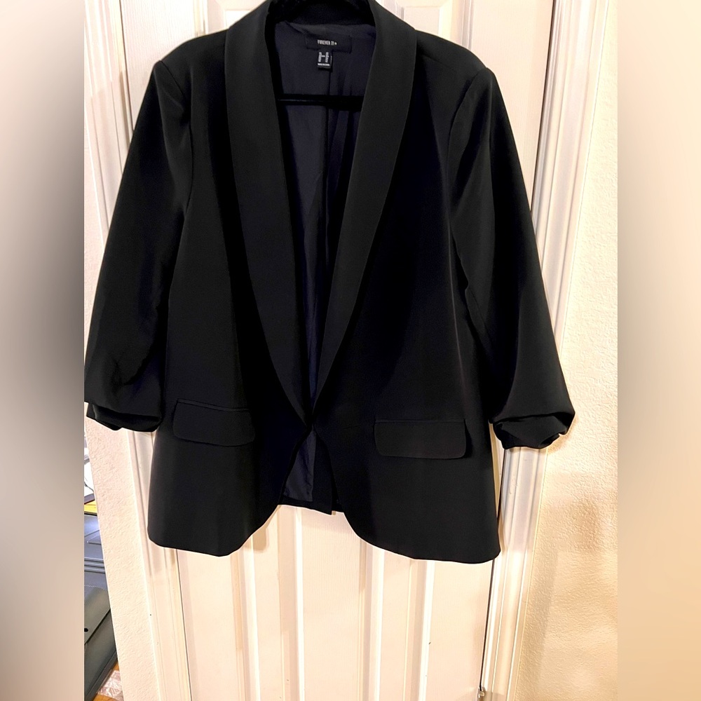 Women’s plus size blazer jacket.